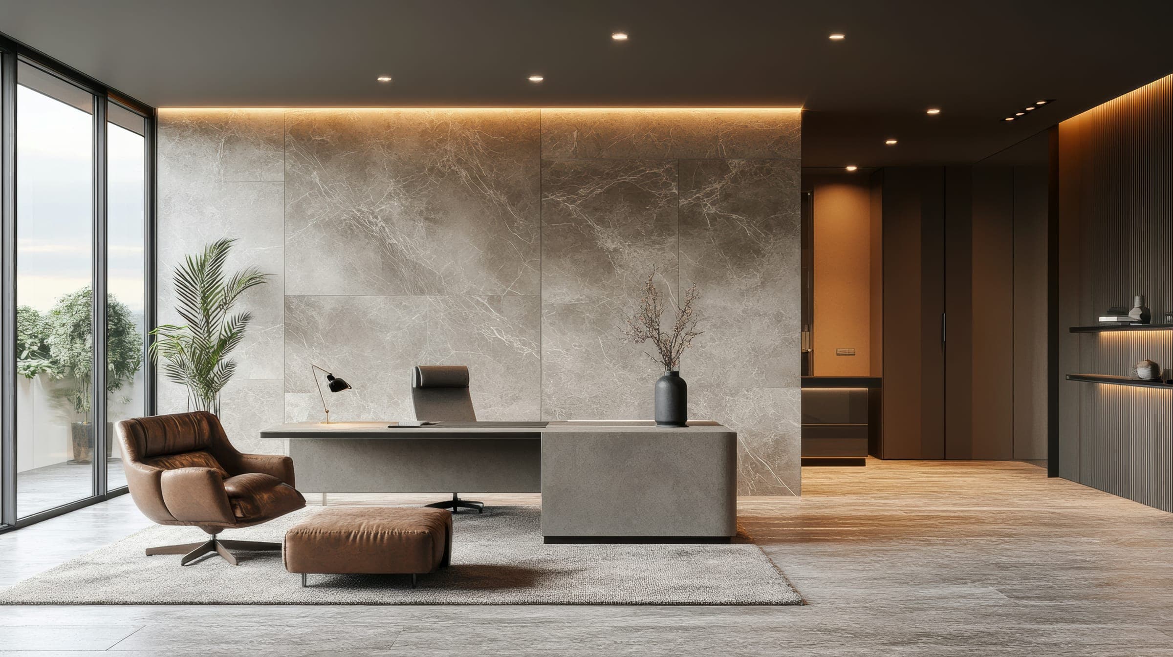 Executive office with marble wall, stone desk, leather lounge chair and floor-to-ceiling windows.